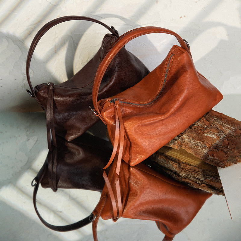 Women's handbags, shoulder-to-shoulder, crossbody, high-end, niche design, hand-held, genuine cowhide, armpit dumpling bag, new autumn and winter models